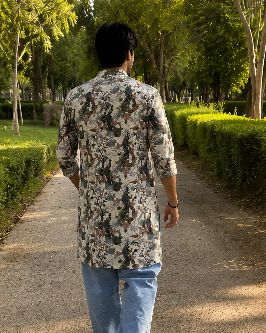 Person walking down a tree-lined path in a park in printed kurta
