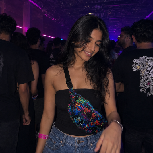 Woman at a party with colorful bag and purple lighting