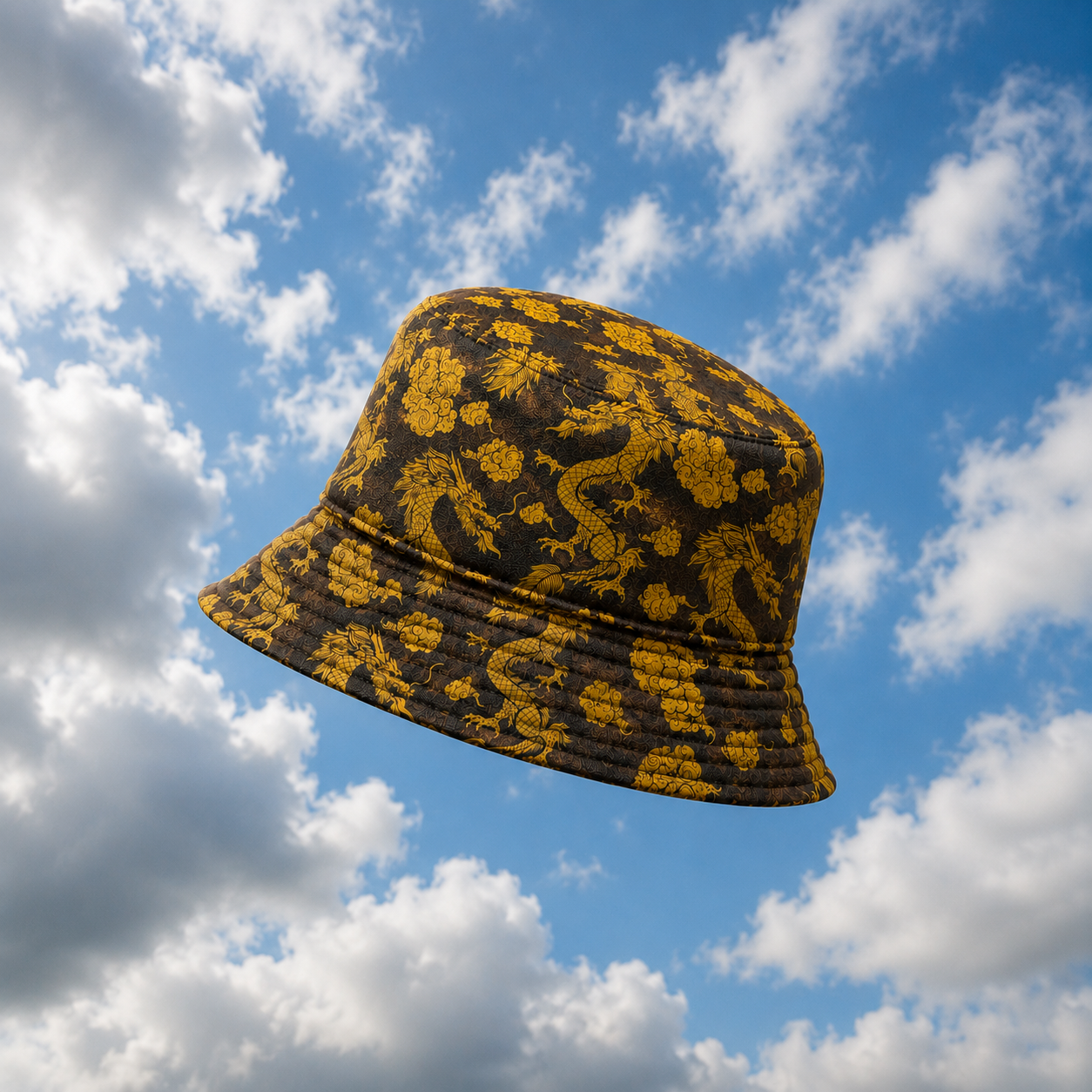 Yellow patterned bucket hat against a blue sky with clouds
