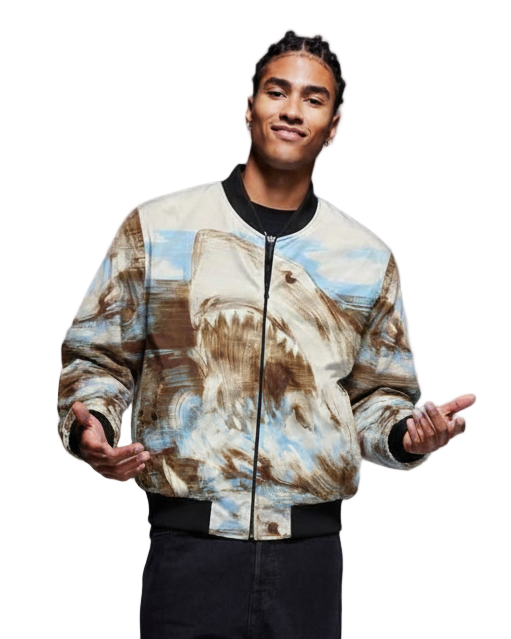 Person wearing a bomber jacket with a mountain and landscape design on a white background